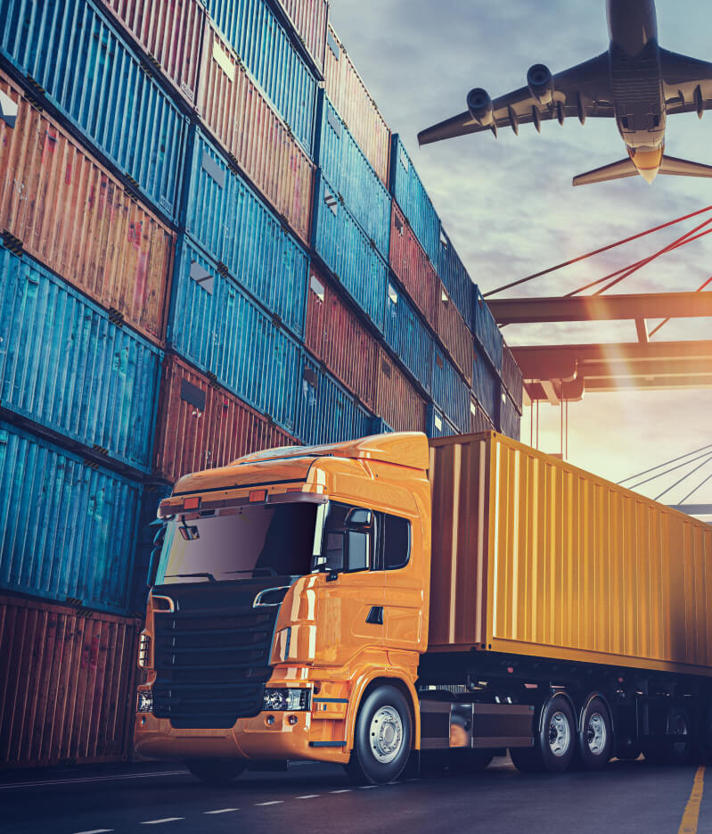 Foreign Trade in Santos | Affinity Logística Internacional Illustrative photo of a truck parked next to containers in a port, with an airplane flying over them.