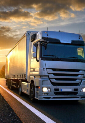 Domestic & Ground Transport in Santos | Affinity Logística Internacional Illustrative photo of a truck on the highway.